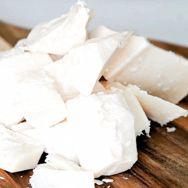 Tallow chunks on a dark wooden table