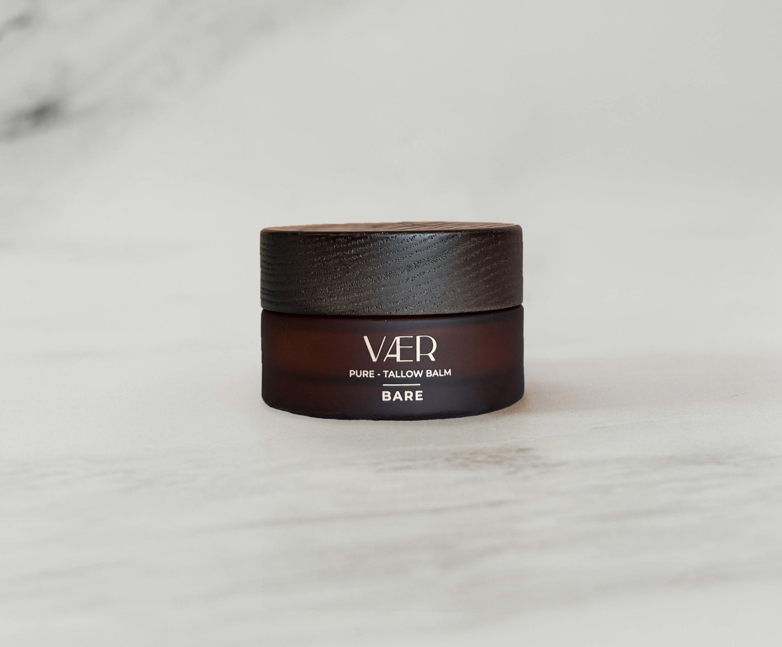 Jar of Vaer Pure Tallow Balm on a marble surface